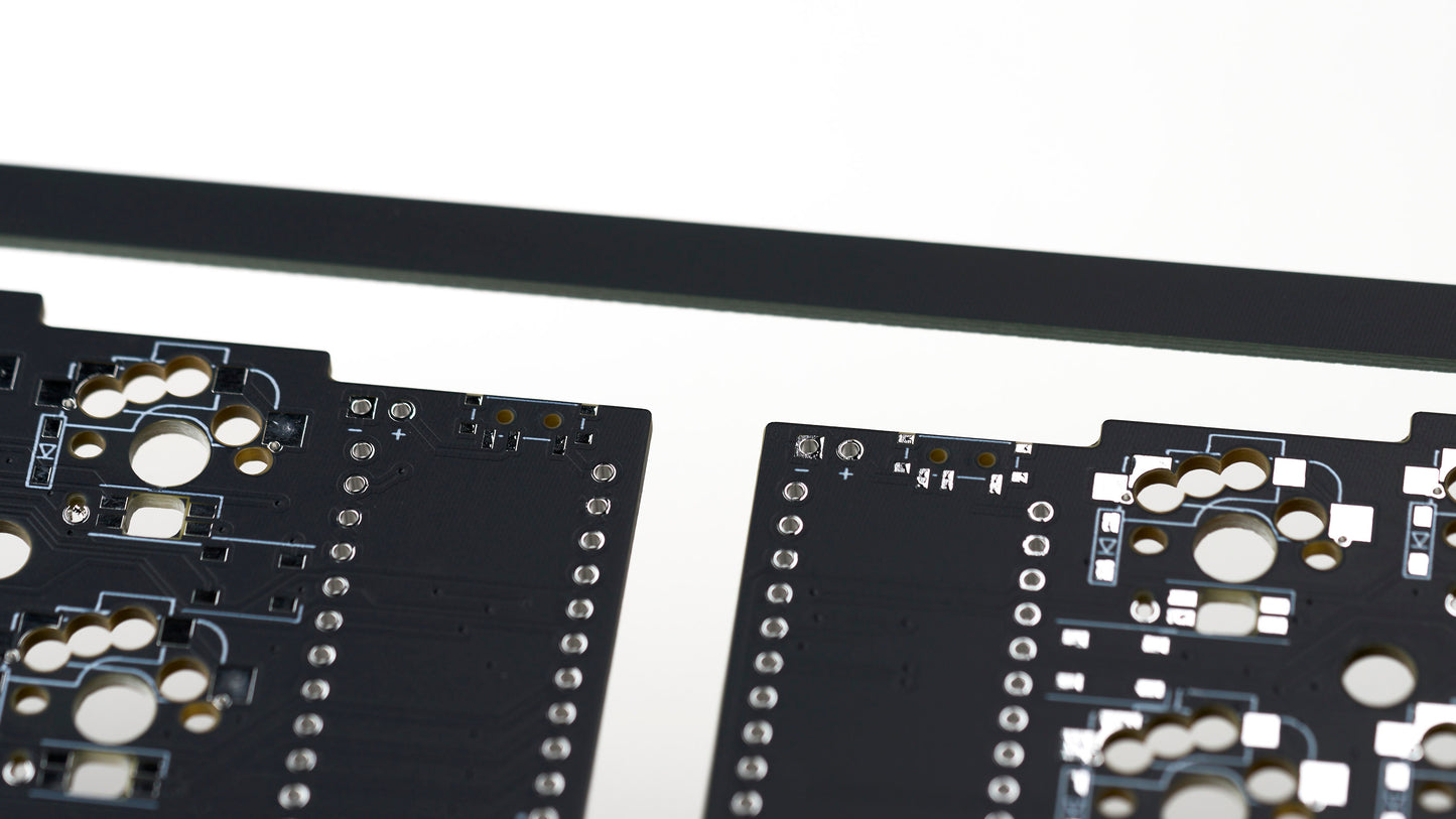 Corne v3.6 solderable PCB closeup showing power switch and battery lead pads for wireless builds