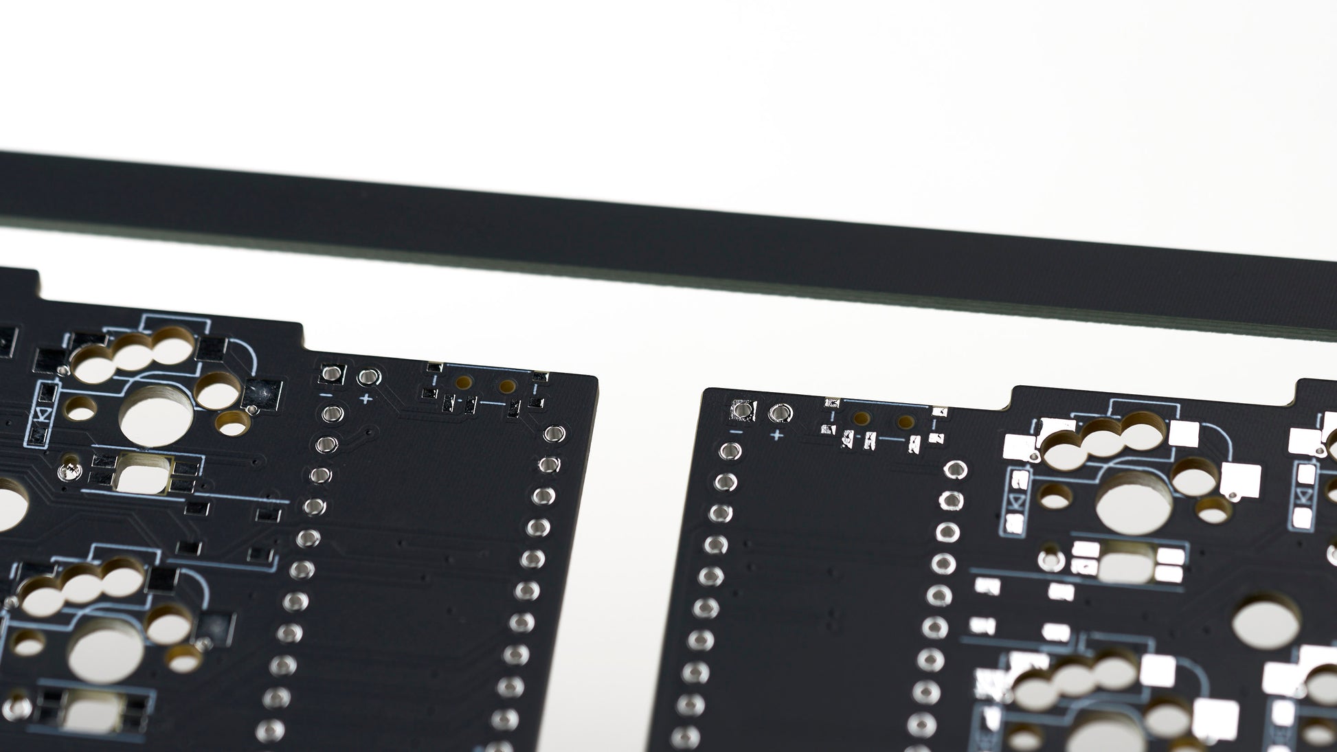 Corne v3.6 solderable PCB closeup showing power switch and battery lead pads for wireless builds