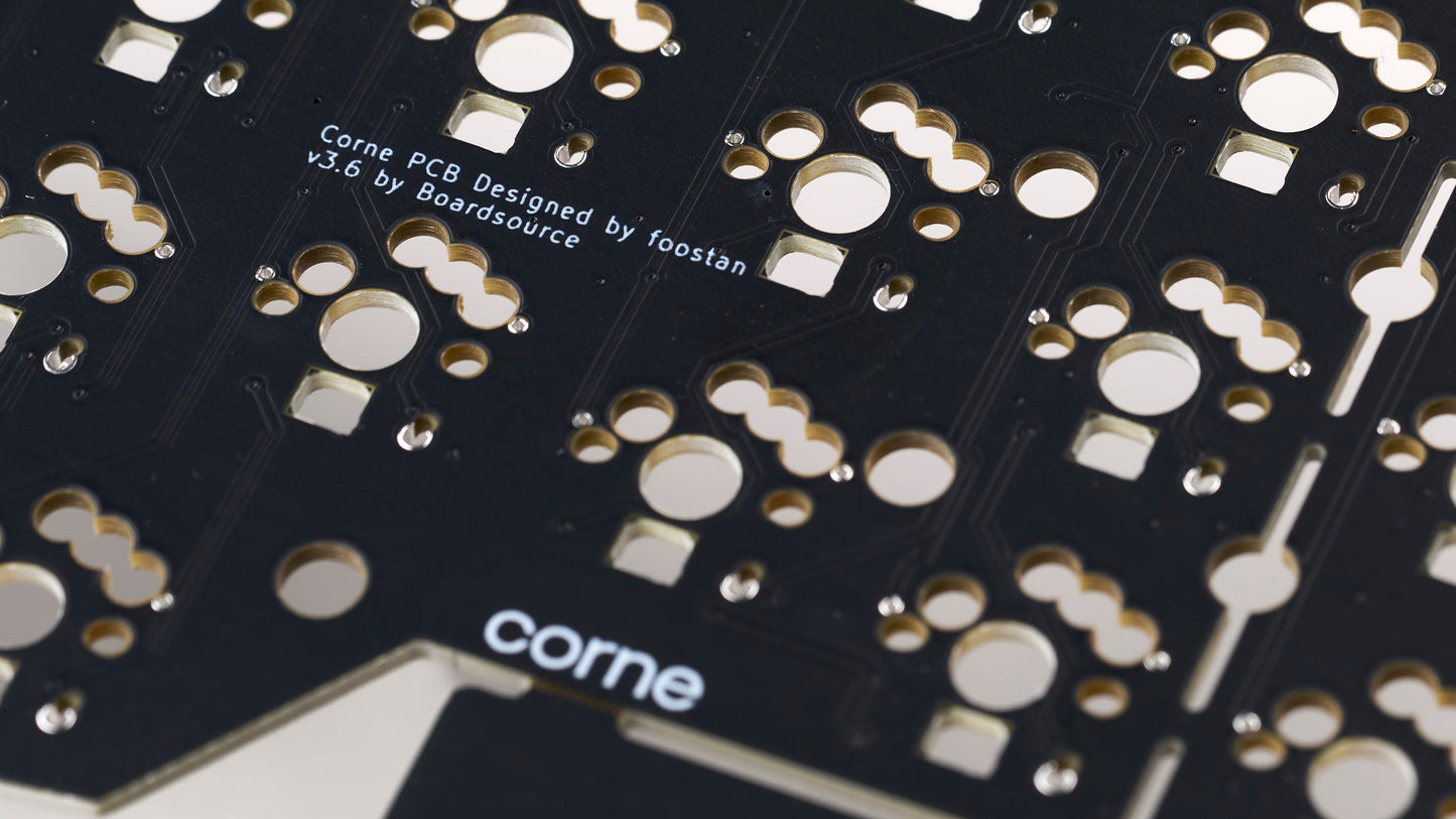 Closeup of Corne v3.6 PCB showing designer attribution to Foostan and Boardsource branding