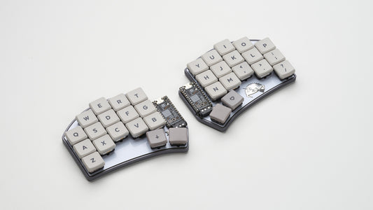 Top-down view of a Ferris Sweep keyboard with gray and beige keycaps in a Crab Broom aluminum case