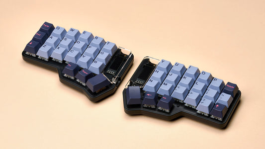 Unicorne split keyboard with GMK 8008 keycaps on a beige background.
